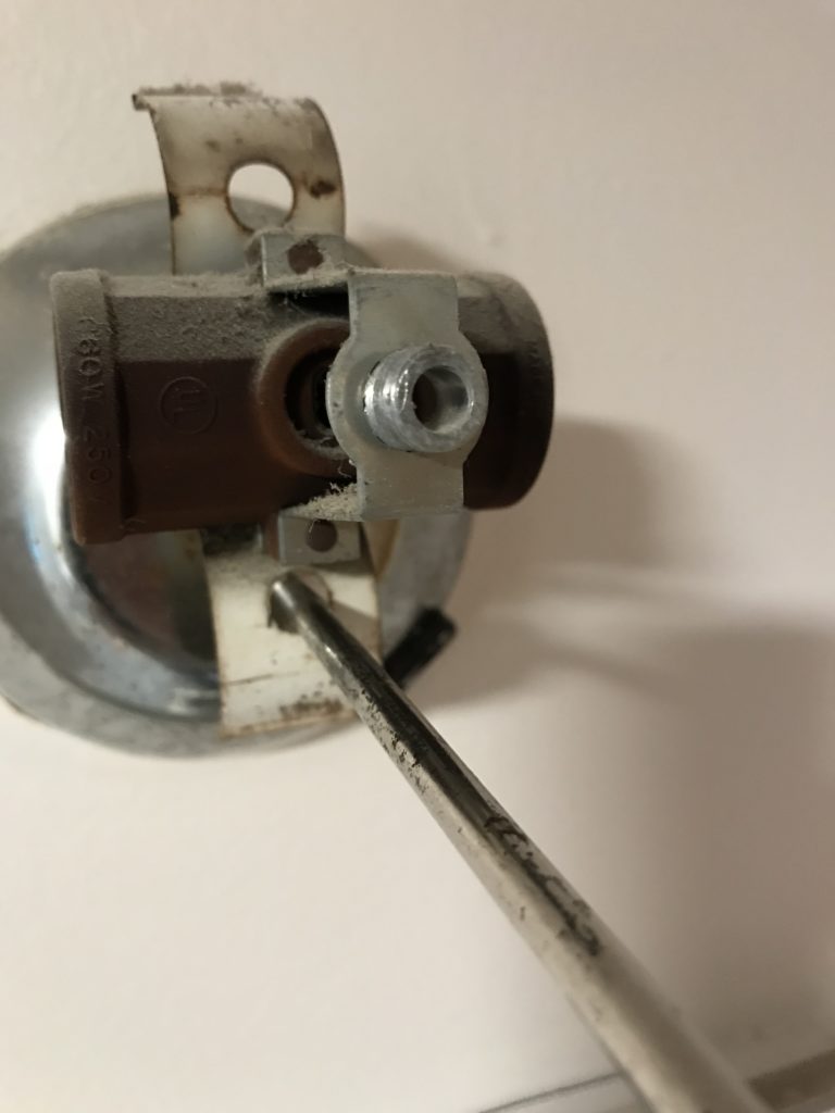 unscrewing old fixture