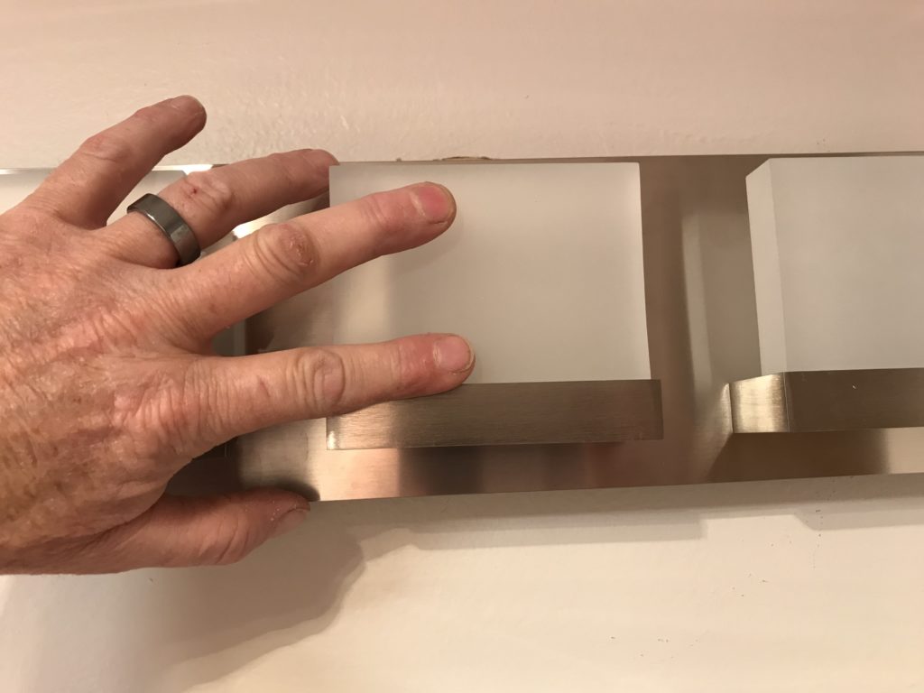 mounting new light on wall