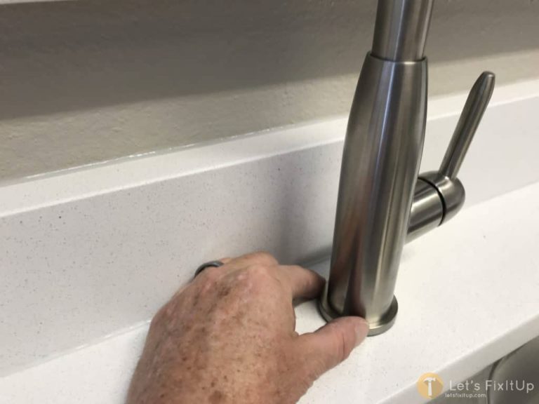 aligning new kitchen faucet
