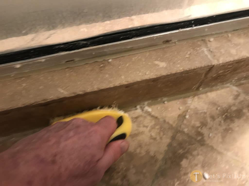 scrub bathroom tile and grout with vinegar and baking soda